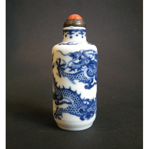 Snuff bottle porcelain blue and white painted in nice undergglaze blue with dragon and clouds
